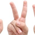Hands displaying various peace sign gestures, symbolizing communication and positivity related to plumbing services and home construction tips.