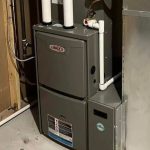 Furnace unit installed in a basement, showcasing heating system maintenance importance for homeowners preparing for winter.