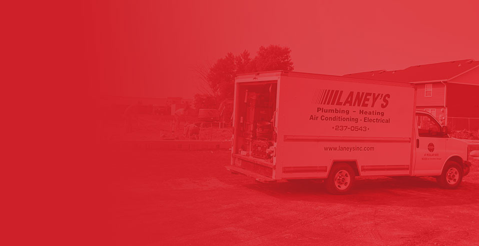 Laney's Inc. service truck parked, showcasing plumbing, heating, air conditioning, and electrical services in Fargo, ND.